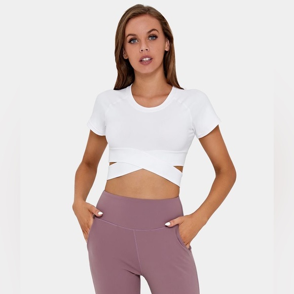 HALARA Tops - HALARA Cut Out Crossover Hem Cropped Sports Top in White Size Large NWT